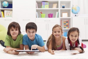 Happy kids using tablet computers